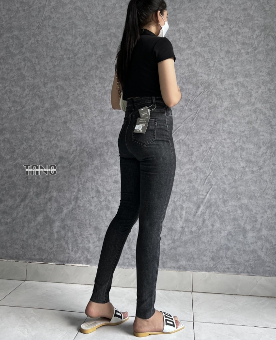 Quần jeans giãn ống ôm màu xám rách 1 bên đùi,lai cắt